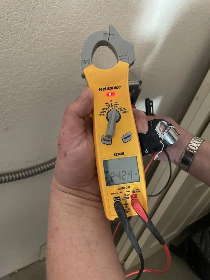 Voltage testing with clamp meter during Outlet Installation in Victoria